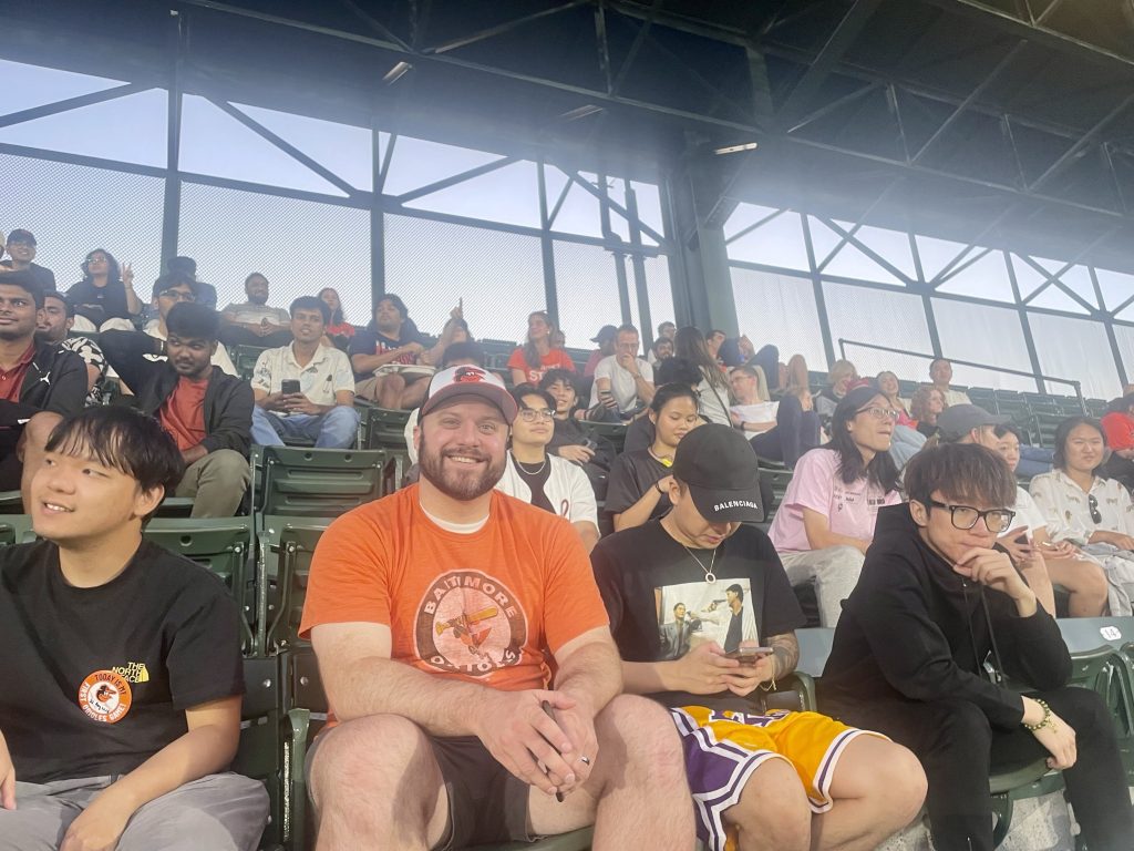 Students in Baltimore Orioles baseball stadium seats.